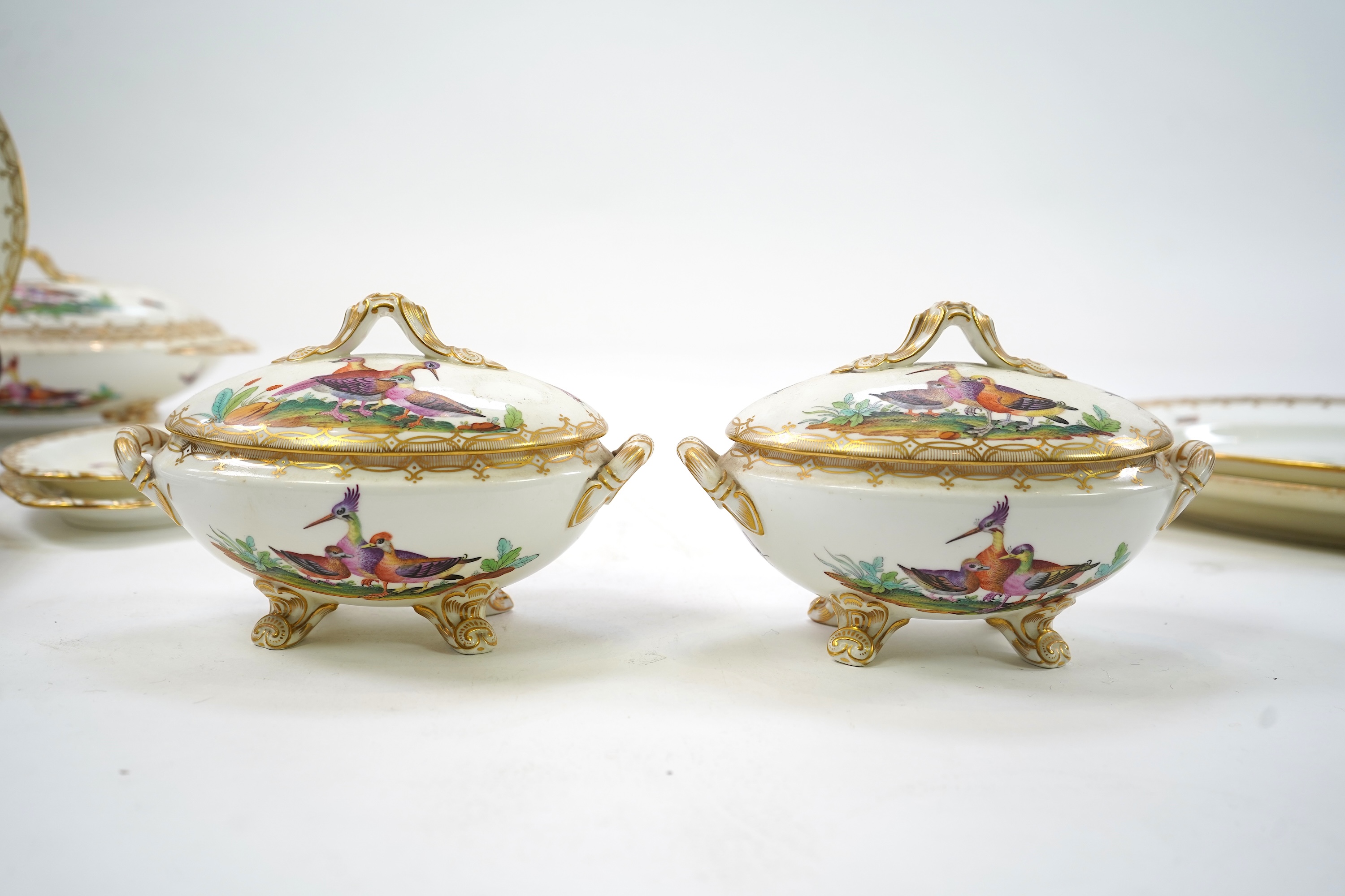 A Coalport bird painted part dinner service, mid 19th century